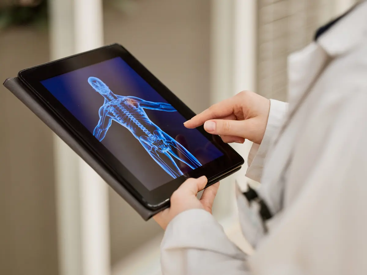 Clinician reviewing a 3D body composition scan on a tablet